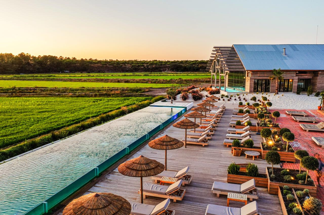 Quinta da Comporta — long pool beside the rice fields at dusk